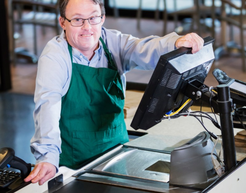 smiling-employee-at-checkout